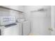 Laundry room featuring a washing machine, dryer and wire shelving at 6595 Lancelot Ct, Riverdale, GA 30296