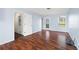 Living room with hard surface floors and access to a backyard deck at 6595 Lancelot Ct, Riverdale, GA 30296