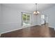 Dining room with hardwood floors, chandelier, and access to a patio through sliding glass doors at 2849 Appling Nw Way, Kennesaw, GA 30152