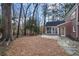 Beautiful brick home with a stone patio in the backyard surrounded by mature trees at 2947 Margaret Mitchell Nw Ct, Atlanta, GA 30327
