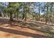 Expansive backyard with mature trees, providing ample shade and privacy at 2947 Margaret Mitchell Nw Ct, Atlanta, GA 30327