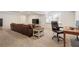 Finished basement area featuring neutral carpet, leather couch and office desk, perfect for a home office and relaxing at 2947 Margaret Mitchell Nw Ct, Atlanta, GA 30327