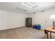 Finished basement featuring neutral carpet, storage safe, and paneled walls at 2947 Margaret Mitchell Nw Ct, Atlanta, GA 30327