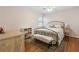 Cozy bedroom featuring a metal frame bed, vintage rug, and light pink walls that create a relaxing atmosphere at 2947 Margaret Mitchell Nw Ct, Atlanta, GA 30327