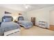 Spacious bedroom with twin beds, natural light, and a charming ambiance, great for comfort and relaxation at 2947 Margaret Mitchell Nw Ct, Atlanta, GA 30327