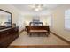 Cozy bedroom features hardwood floors, natural light, and comfortable furnishings at 2947 Margaret Mitchell Nw Ct, Atlanta, GA 30327