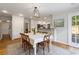 Bright dining area adjacent to the kitchen with hardwood floors and natural lighting at 2947 Margaret Mitchell Nw Ct, Atlanta, GA 30327