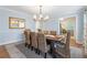 Warm dining room showcasing seating for eight and classic details at 2947 Margaret Mitchell Nw Ct, Atlanta, GA 30327