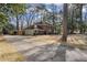Traditional two-story brick home with a large driveway and well-maintained landscaping at 2947 Margaret Mitchell Nw Ct, Atlanta, GA 30327