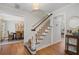 Inviting foyer showcasing hardwood floors, staircase, and views into the dining room at 2947 Margaret Mitchell Nw Ct, Atlanta, GA 30327
