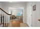 Bright foyer featuring hardwood floors and an open view to the living room area at 2947 Margaret Mitchell Nw Ct, Atlanta, GA 30327
