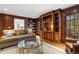 Comfortable living room with hardwood floors, wood cabinets, and a large window to the porch at 2947 Margaret Mitchell Nw Ct, Atlanta, GA 30327