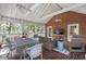 Inviting screened porch with brick accents, offering a perfect blend of indoor/outdoor living at 2947 Margaret Mitchell Nw Ct, Atlanta, GA 30327