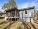 Exterior view of the house featuring a screened-in porch and well-maintained siding at 3668 Bunker Hill Sw Dr, Atlanta, GA 30331