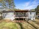 Cozy home exterior featuring a screened-in back porch at 3668 Bunker Hill Sw Dr, Atlanta, GA 30331