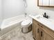 Clean bathroom featuring a shower-tub combo and a modern vanity at 3668 Bunker Hill Sw Dr, Atlanta, GA 30331