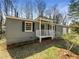 Charming single-story home with gray siding and a well-maintained front yard at 3668 Bunker Hill Sw Dr, Atlanta, GA 30331