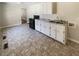 Kitchen features white cabinets and a black oven at 3668 Bunker Hill Sw Dr, Atlanta, GA 30331