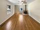 Spacious living room featuring hardwood floors and a modern fireplace at 3668 Bunker Hill Sw Dr, Atlanta, GA 30331
