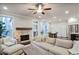 Bright living room featuring a fireplace, hardwood floors, and lots of windows at 5022 Towneship Creek Rd, Roswell, GA 30075