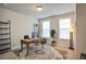 A naturally lit office featuring neutral paint, plush carpet, and a vintage area rug at 5022 Towneship Creek Rd, Roswell, GA 30075