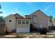 View of the back exterior featuring a beige siding, a deck leading to backyard, and a well maintained yard at 55 Bonds Ct, Hiram, GA 30141