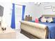 Bedroom boasting large window, luxury furniture and a ceiling fan at 55 Bonds Ct, Hiram, GA 30141