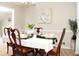Dining room featuring a white table setting with a centerpiece and four chairs at 55 Bonds Ct, Hiram, GA 30141