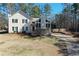 Charming two-story home with a stone facade, complemented by a well-manicured lawn and a long driveway at 55 Bonds Ct, Hiram, GA 30141