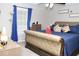 Comfortable main bedroom with a large bed, stylish decor, and soft natural light from the window at 55 Bonds Ct, Hiram, GA 30141