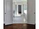 A view through the doorway to the bathroom showing a tub and dark cabinets at 1001 Brading Pl, Lawrenceville, GA 30043