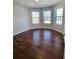 Well lit bedroom with 3 large windows and beautiful hardwood floors at 1001 Brading Pl, Lawrenceville, GA 30043