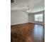 A spacious bedroom features hardwood floors, a ceiling fan, and a window providing natural light at 1001 Brading Pl, Lawrenceville, GA 30043