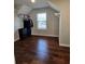 Closet space features hardwood floors, white shelving, and a window at 1001 Brading Pl, Lawrenceville, GA 30043