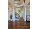 Elegant foyer with hardwood floors, staircase, and decorative columns at 1001 Brading Pl, Lawrenceville, GA 30043