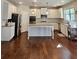 Bright, modern kitchen with white cabinets, stainless steel appliances, and a center island at 1001 Brading Pl, Lawrenceville, GA 30043