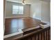 Bright living room with hardwood floors and a ceiling fan at 1001 Brading Pl, Lawrenceville, GA 30043