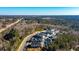 Aerial view of a community nestled in lush greenery, showcasing the layout and surrounding landscape at 10035 River Rock Dr, Roswell, GA 30076