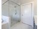 Modern bathroom with a glass shower, marble tiling, and a vanity sink at 10035 River Rock Dr, Roswell, GA 30076