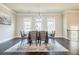 Elegant dining room with stylish chandelier, hardwood floors, and natural light at 10035 River Rock Dr, Roswell, GA 30076