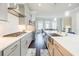 Gourmet kitchen featuring stainless appliances, white cabinets, and sleek countertops at 10035 River Rock Dr, Roswell, GA 30076