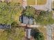 Aerial view of home on tree lined lot with long driveway and detached garage at 1784 Terry Mill Se Rd, Atlanta, GA 30316