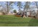 Spacious backyard featuring a manicured lawn, mature trees and patio/deck at 1784 Terry Mill Se Rd, Atlanta, GA 30316