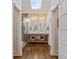Bathroom showcasing a double vanity, a walk-in shower, and a sliding barn door at 1784 Terry Mill Se Rd, Atlanta, GA 30316