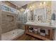Bathroom featuring a double vanity, walk-in shower, and modern finishes at 1784 Terry Mill Se Rd, Atlanta, GA 30316