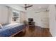 Bright bedroom featuring hardwood floors, a ceiling fan, and a large window with natural light at 1784 Terry Mill Se Rd, Atlanta, GA 30316