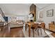 Open-concept living room and dining area featuring hardwood floors and a stone fireplace at 1784 Terry Mill Se Rd, Atlanta, GA 30316