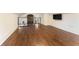 Loft area with hardwood floors, a staircase railing, and a mounted TV at 1784 Terry Mill Se Rd, Atlanta, GA 30316