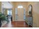 Inviting foyer with hardwood floors, stylish decor, and lots of natural light at 480 Firelite Ln, Suwanee, GA 30024