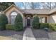 Inviting home exterior features a manicured lawn, mature bushes, and a classic front door at 480 Firelite Ln, Suwanee, GA 30024